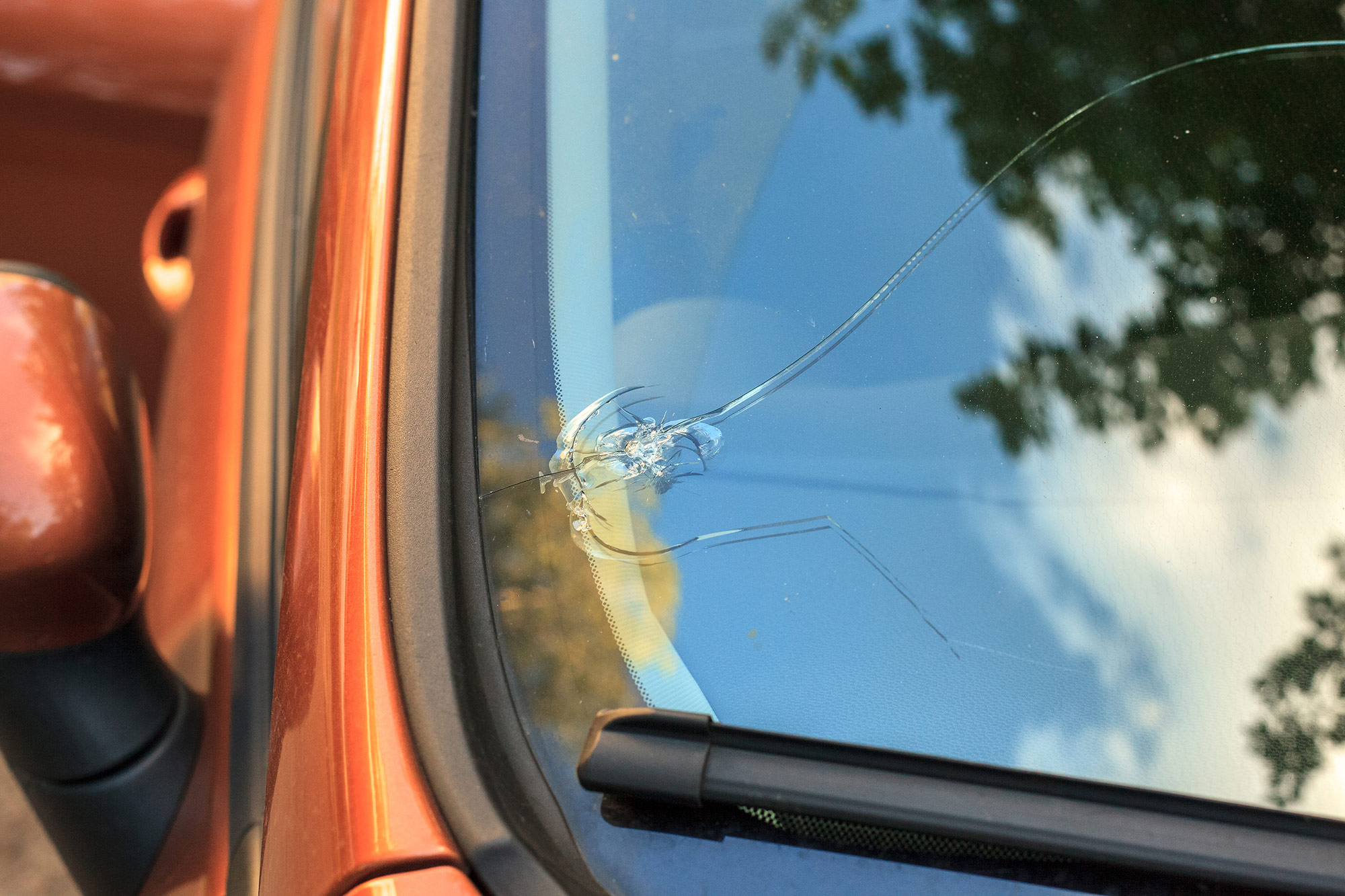 Close-up of chip in a vehicle's windshield.