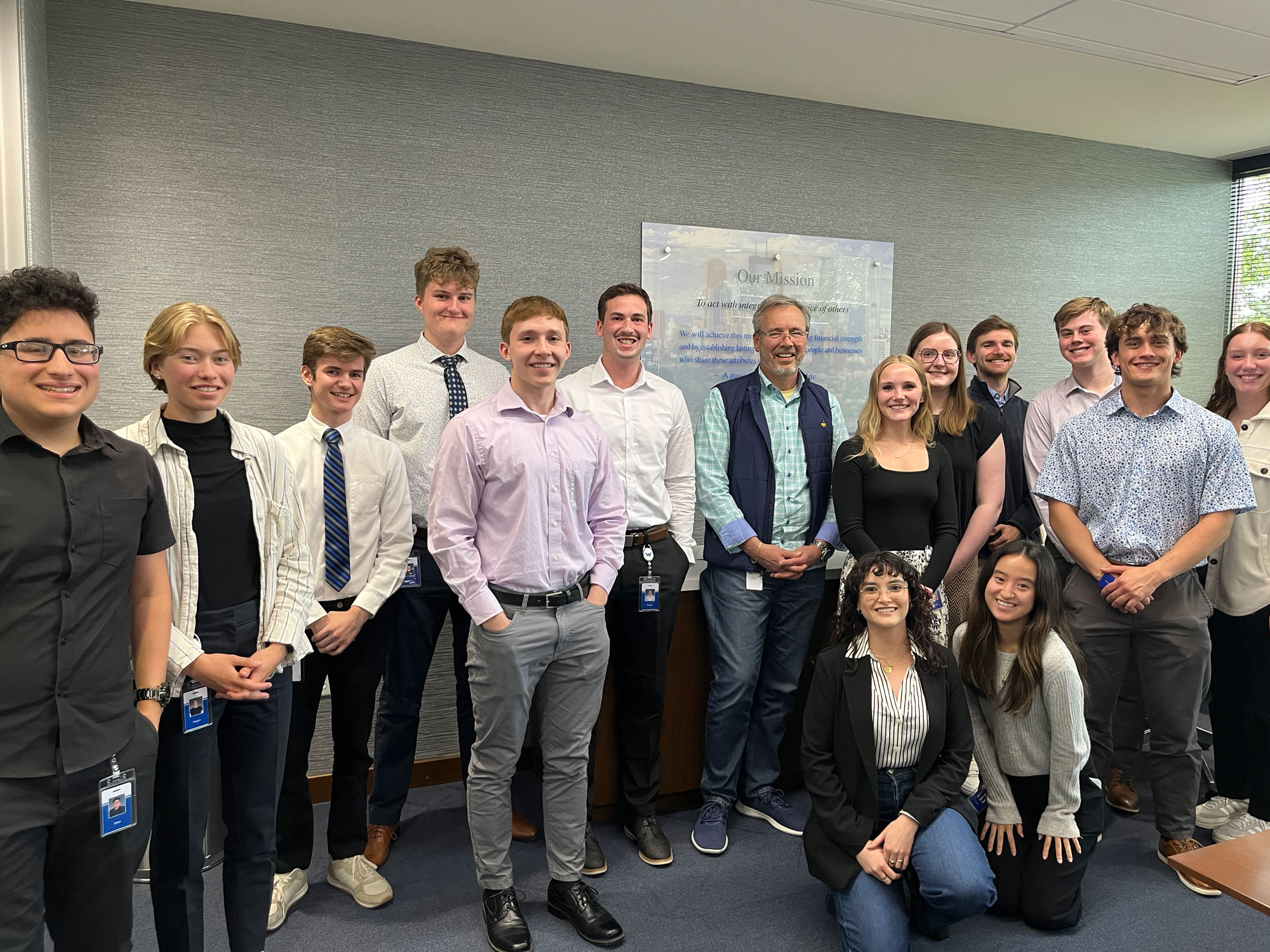A group on interns standing with President and CEO, Rick Long.