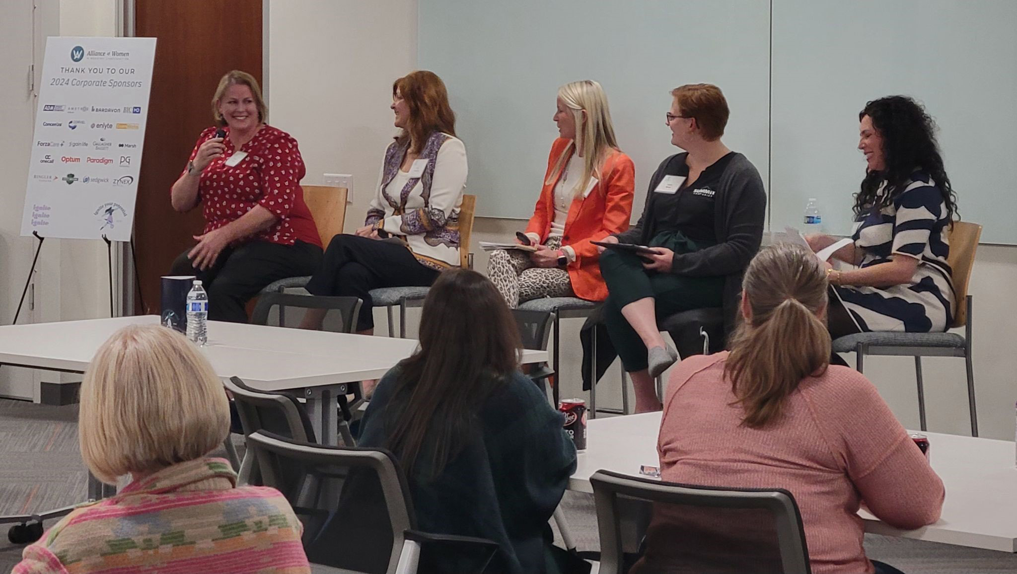 A group of women at the Alliance of Women in Workers' Compensation event.